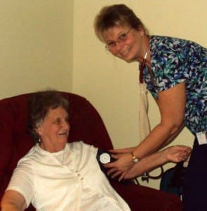 In Home Solutions Nurse takes blood pressure